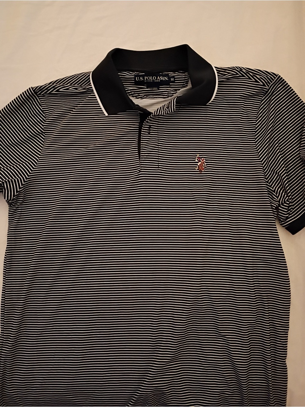 U.S. Polo Assn. Men’s Black and White Thin-Striped Polo